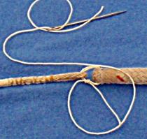 Attaching a messenger line to the end of a halyard with whipping twine and a sailmakers needle
