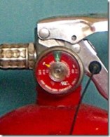 closeup of a partially discharged fire extinguisher gauge